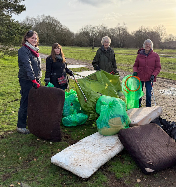 Beverley, 2nd from left, helps clear an abandoned camp at Old Park